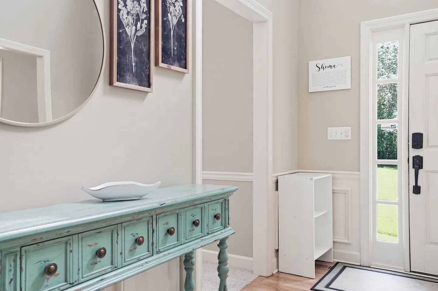 Entry area with console table and front door