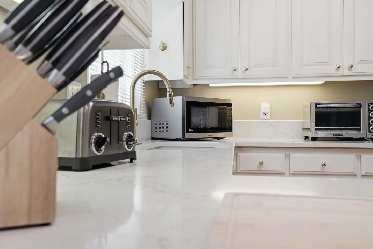 Kitchen counter with microwave and cabinets